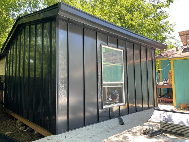 Black standing seam metal wall panels for Metal Roof Installation in Plum